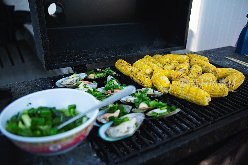 Mussel and corn on grill